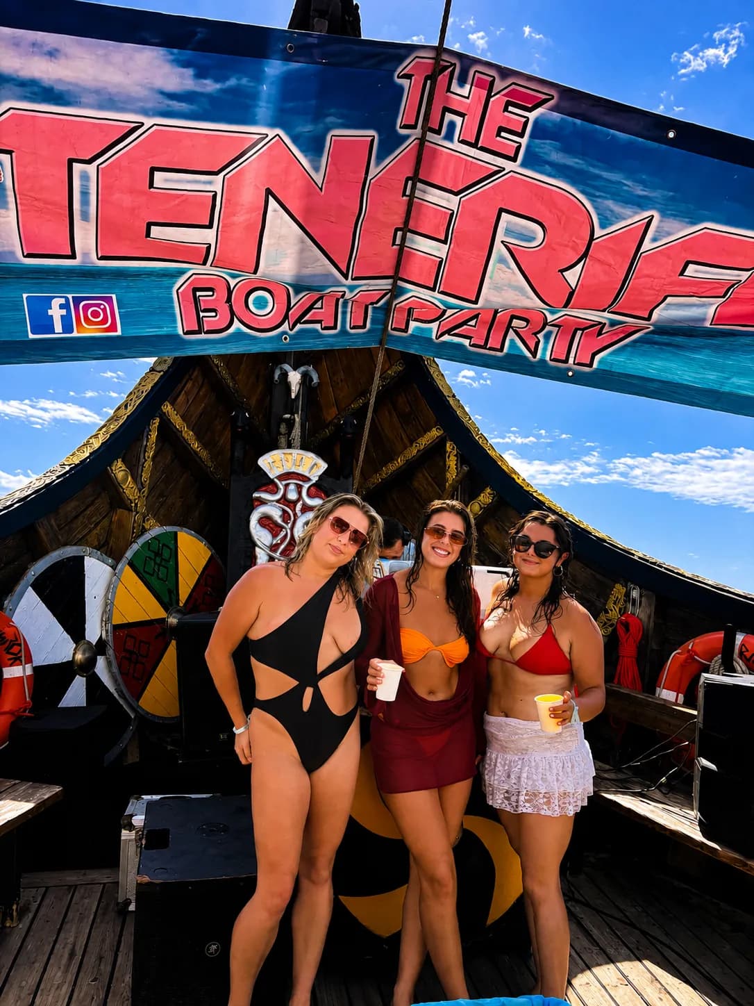 Three women posing at The Fiesta Boat Party themed deck bar