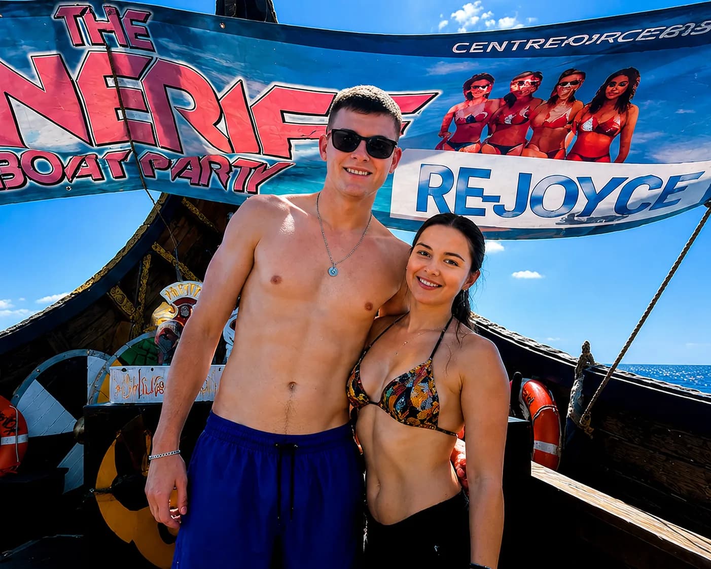 Couple posing on deck of The Nerie boat party vessel in Tenerife